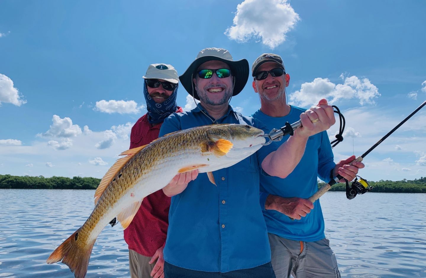 Anglers with their catch in a scenic location