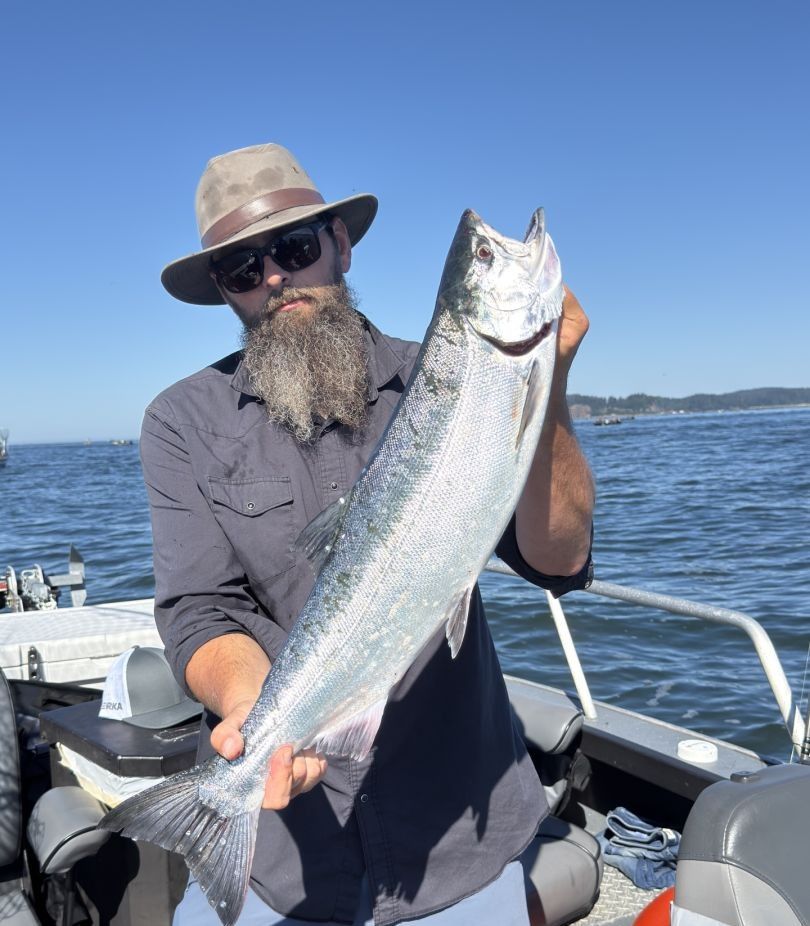 Fisherman catching a sea trout while fishing