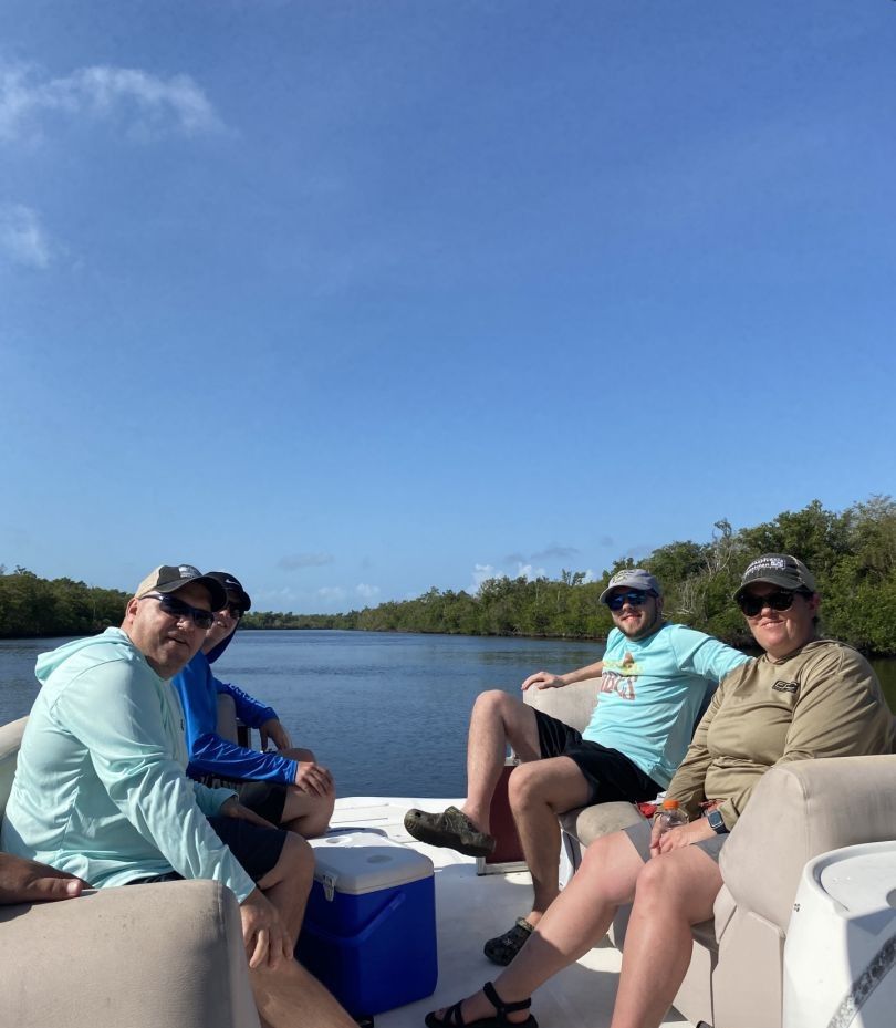 Three people fishing at an unspecified location.