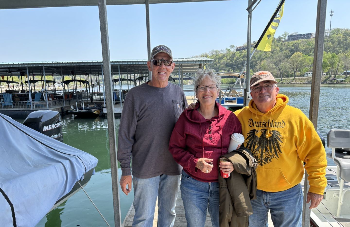 Three people fishing in a scenic location