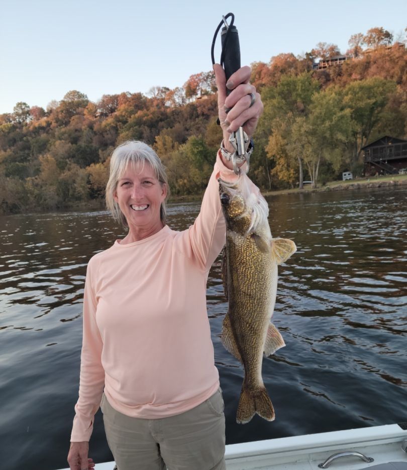 Successful angler with a walleye fish