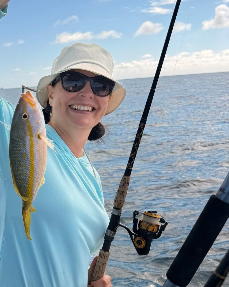 Yellowfin fish catch displayed on fishing boat over ocean water