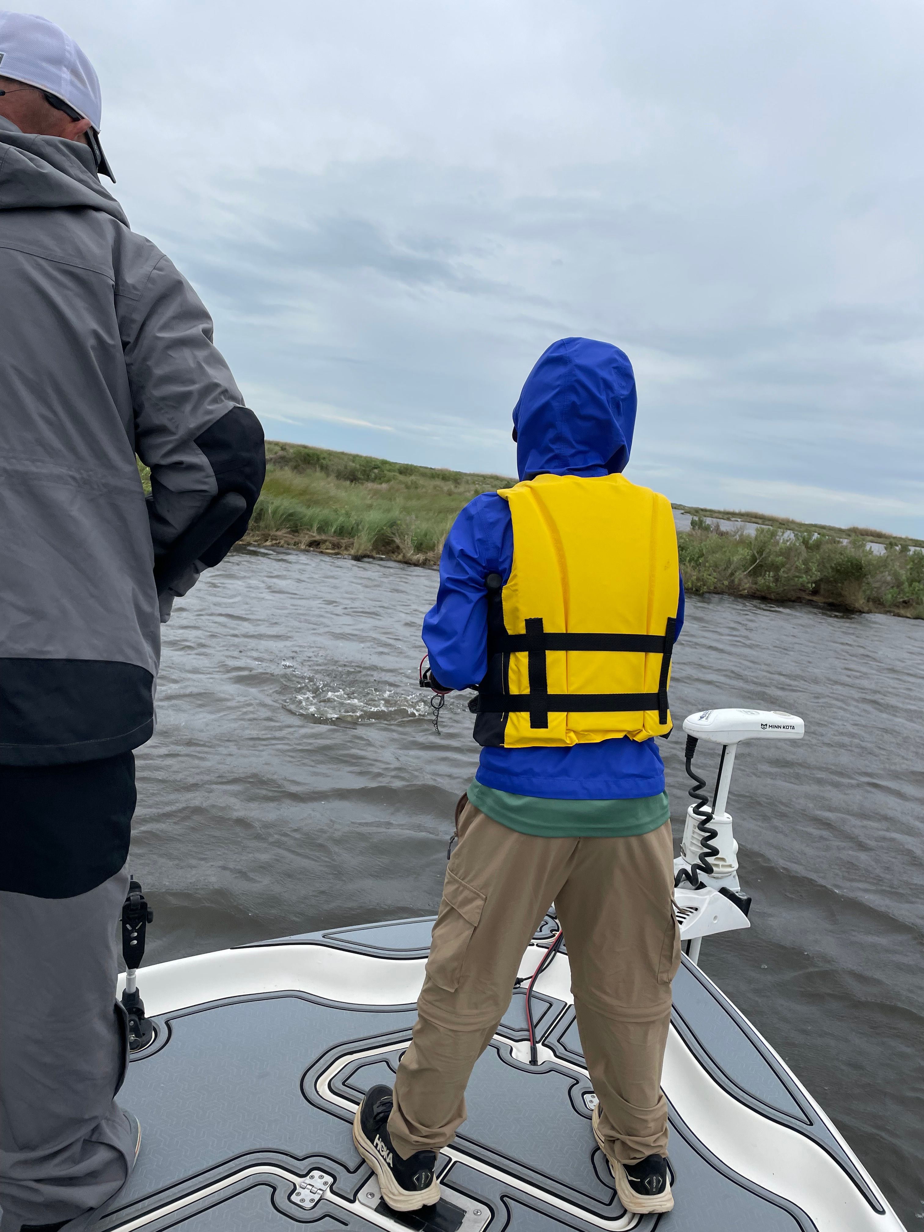 Boat on open water with safety equipment visible on deck