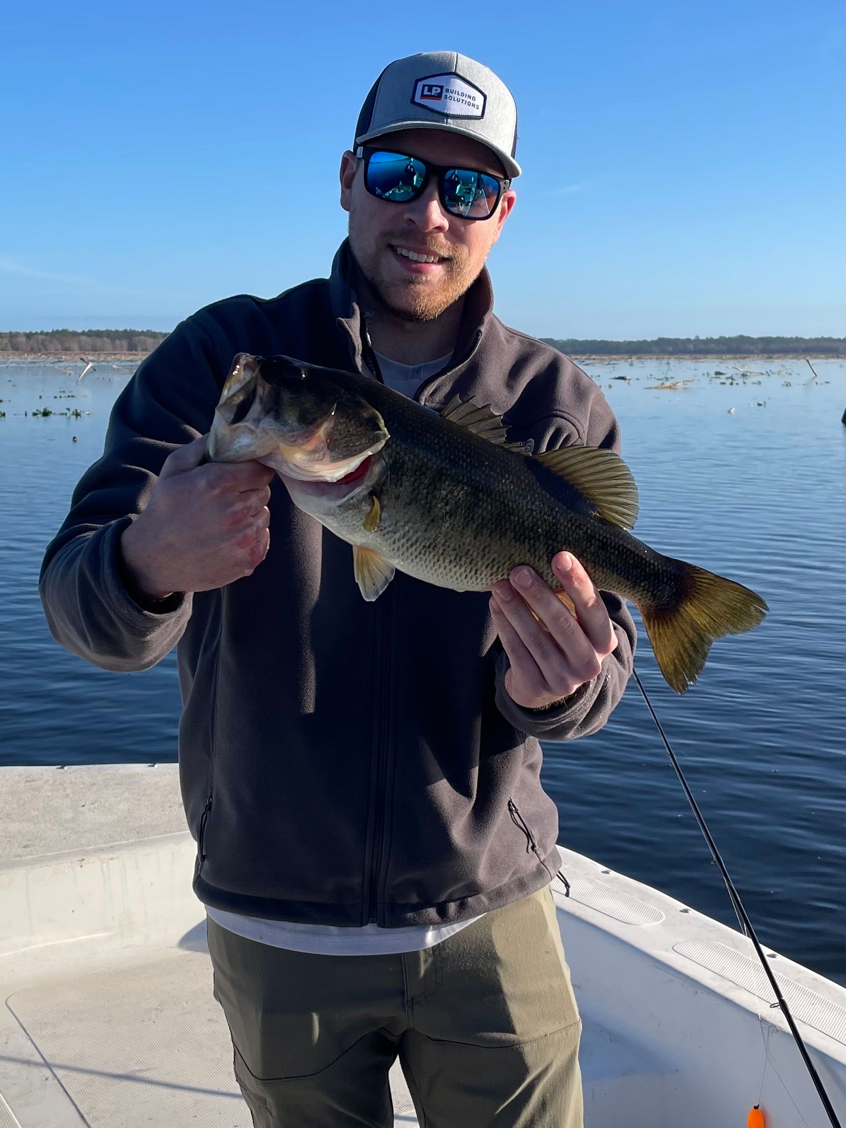 A person fishing in an unknown location