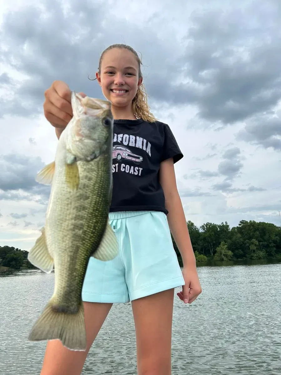 Large bass catch displayed after successful fishing trip