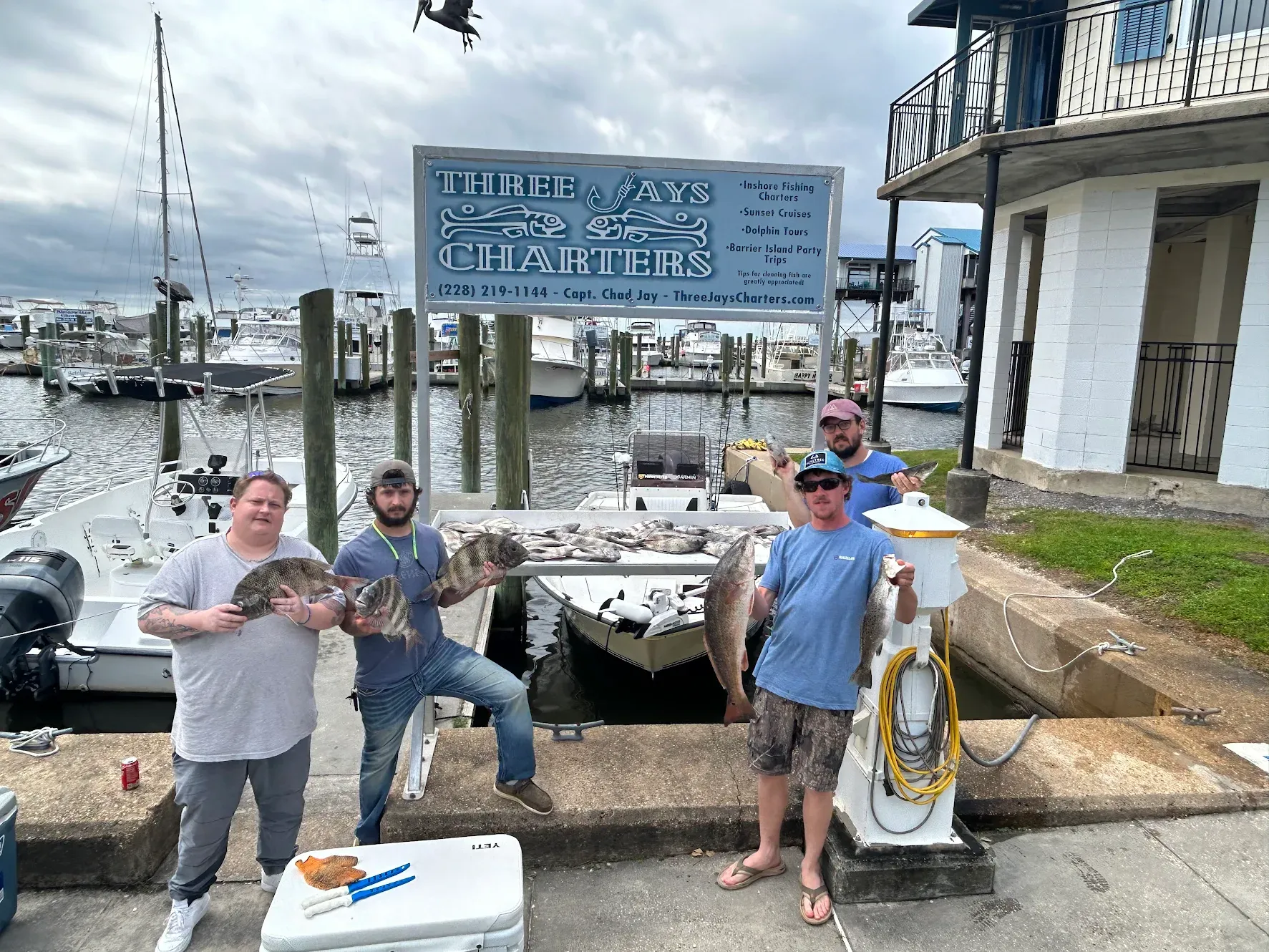 Four people fishing in an unknown location