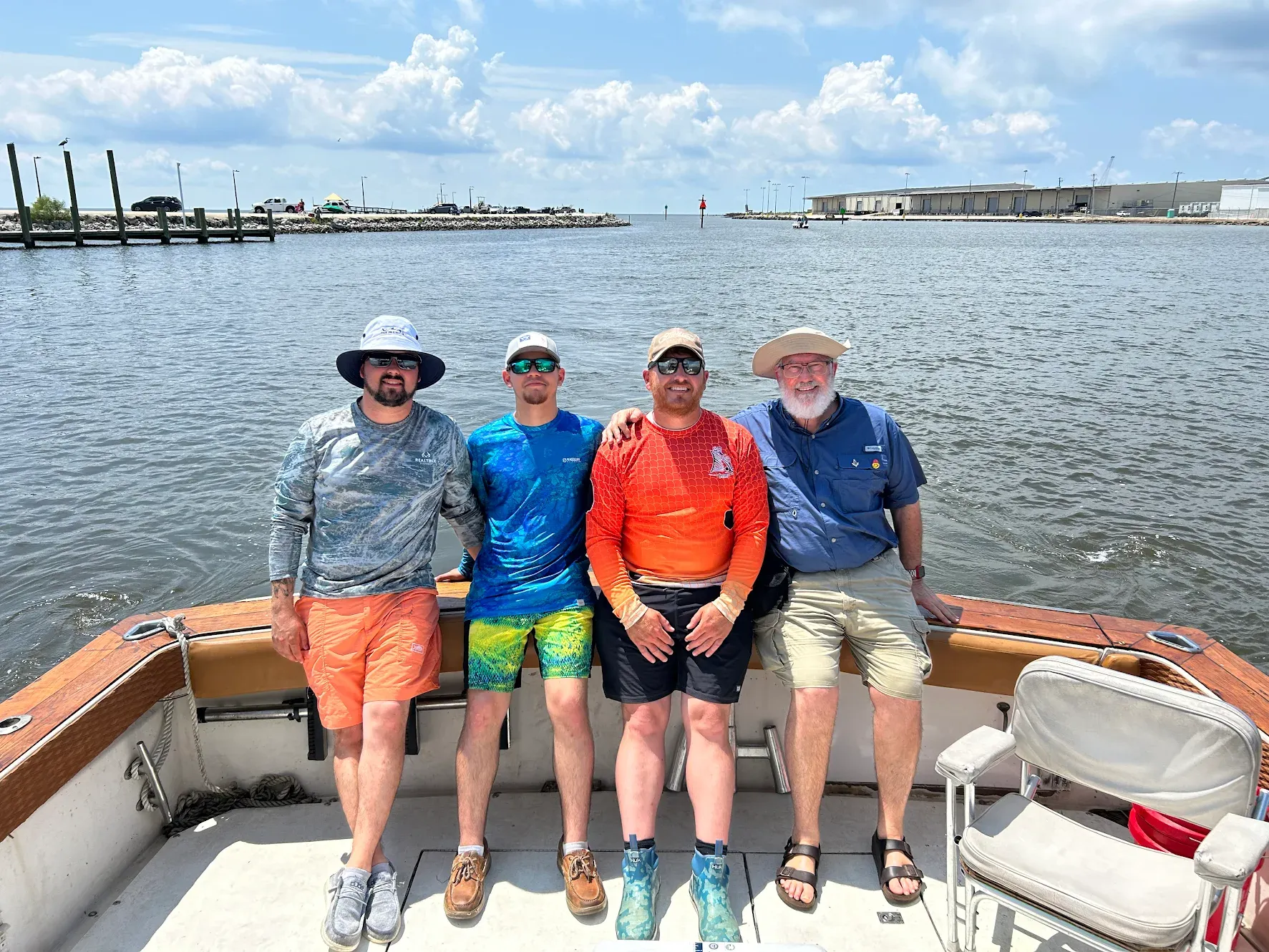 Four people fishing at an unknown location