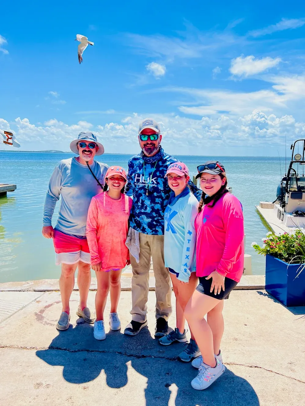 group of 5 people fishing in unknown location