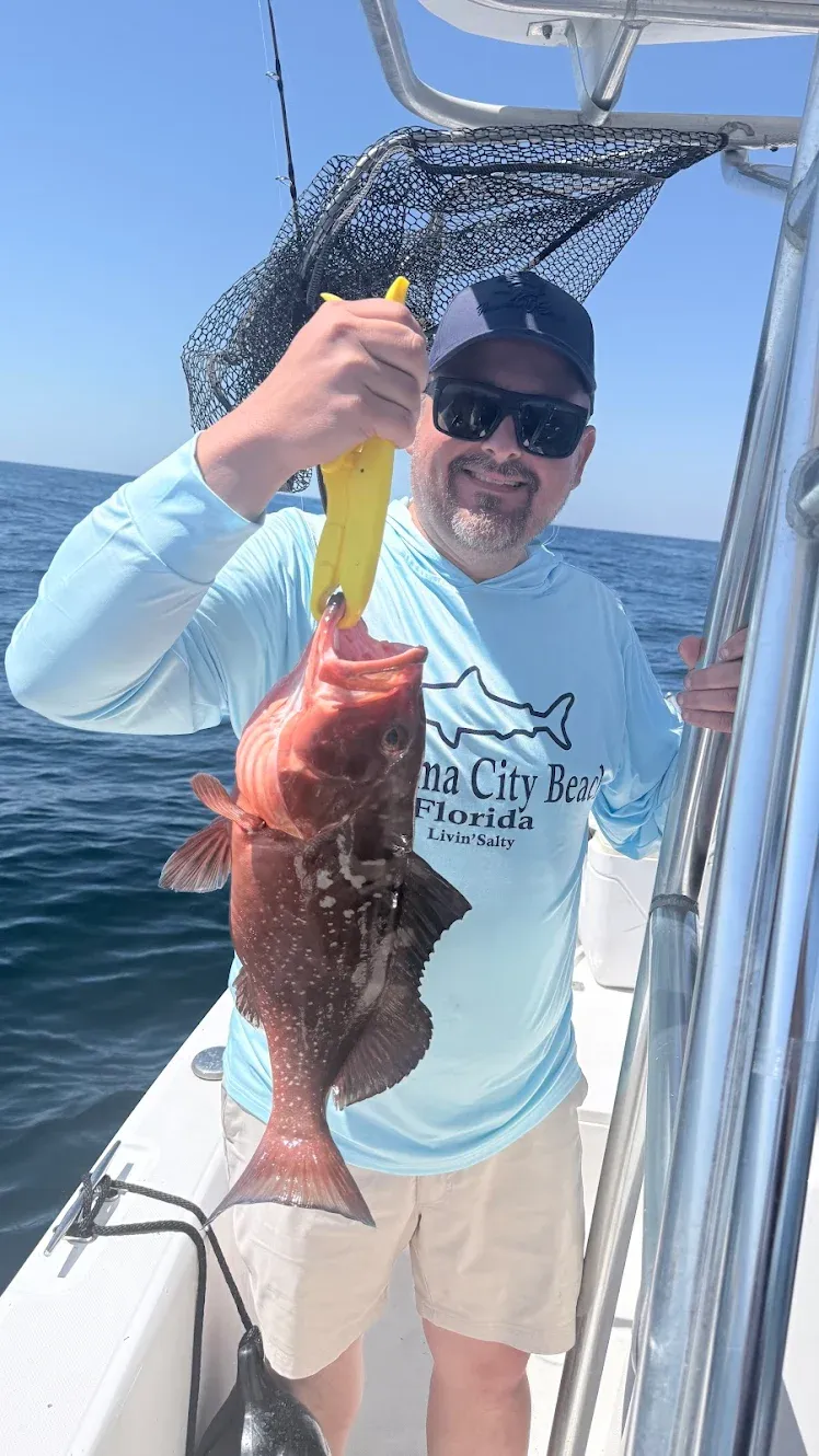 Red grouper caught while fishing on boat in ocean