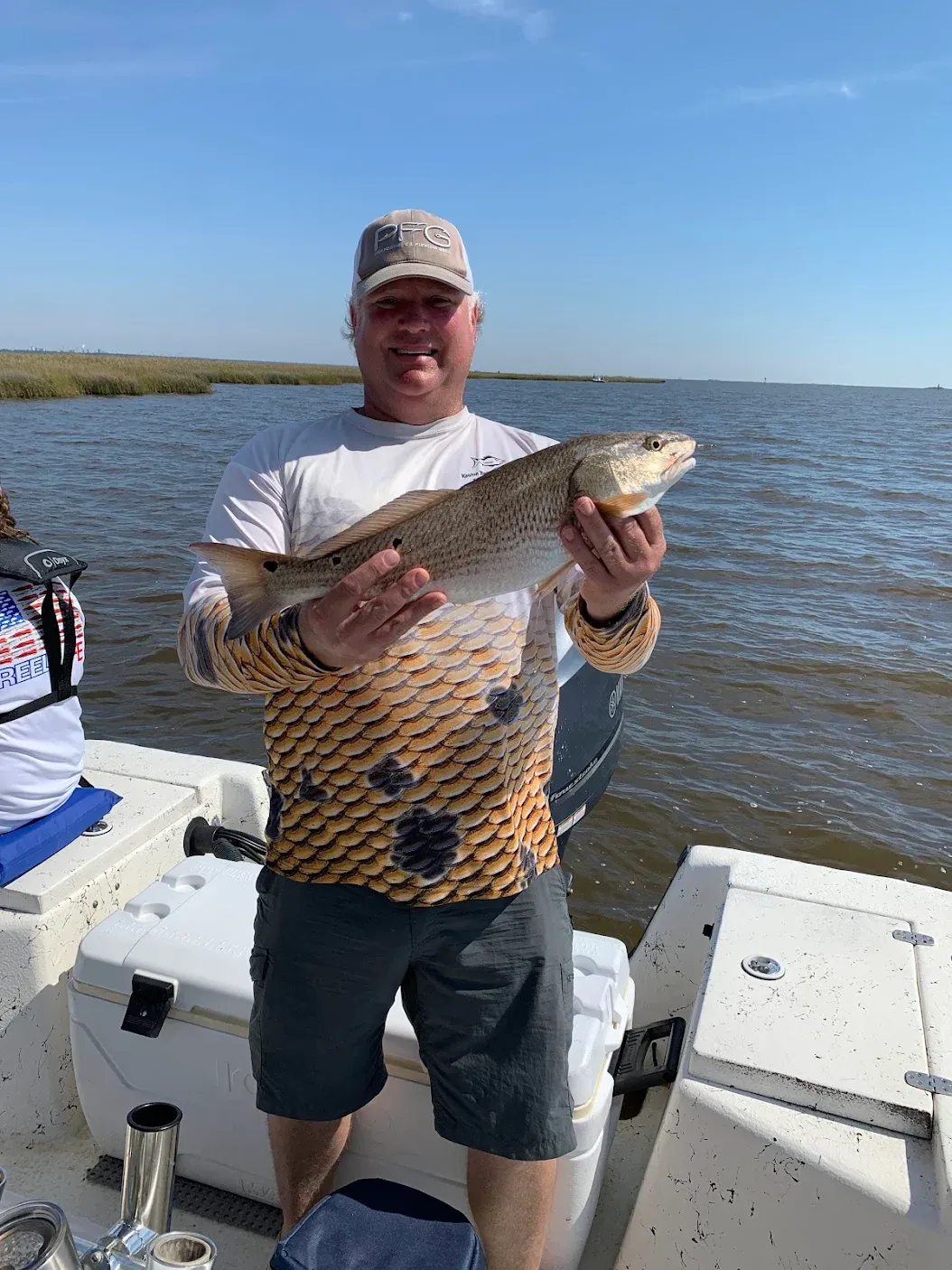 Angler holding a redfish