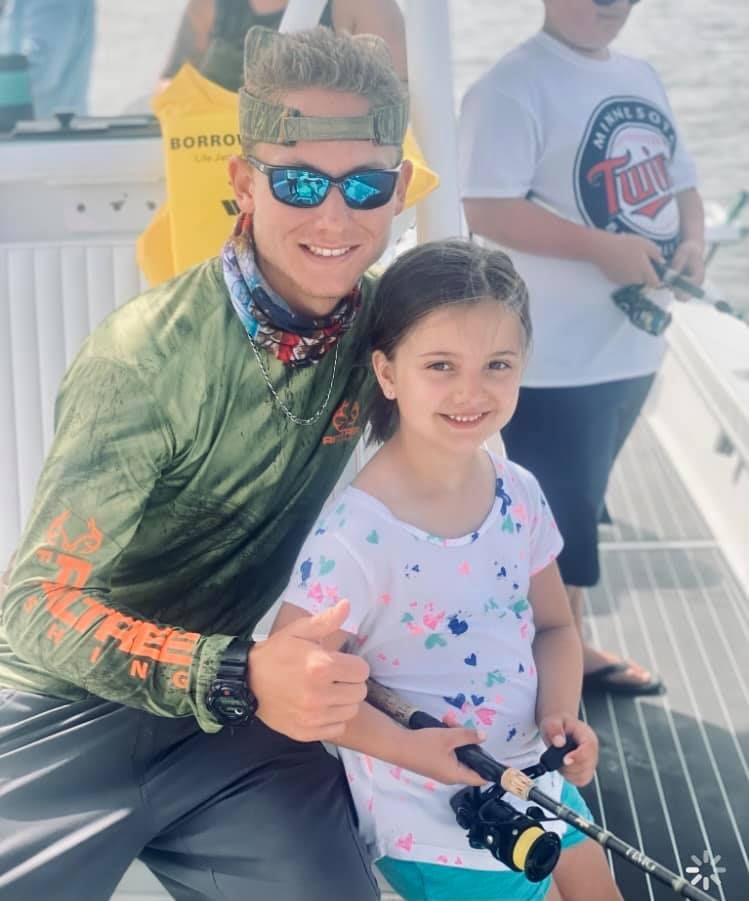 Two people fishing in a scenic location