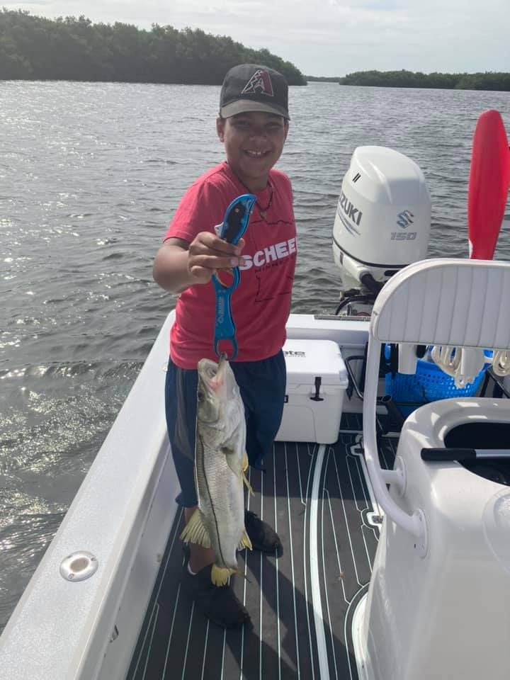 Photo of a 15-inch snook caught while fishing