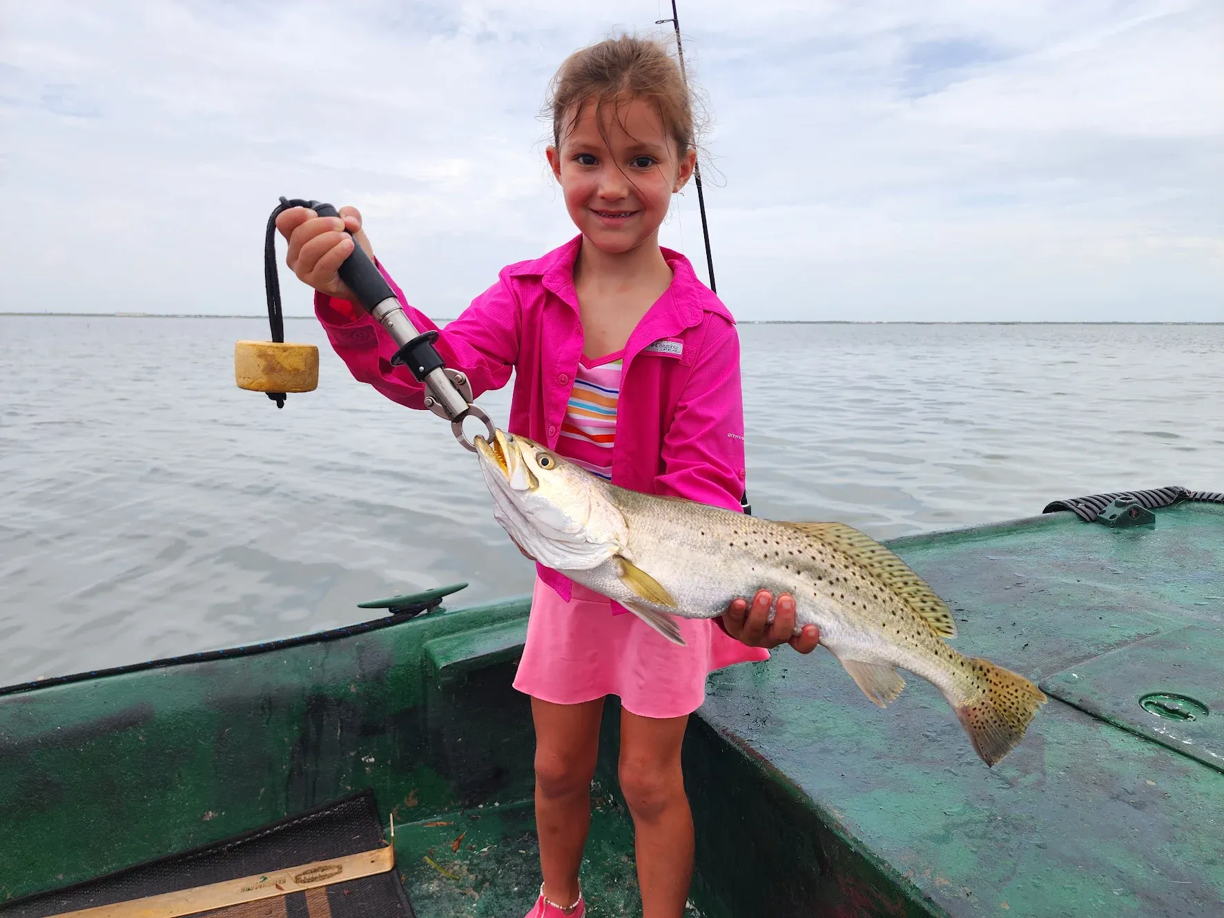 Speckled trout caught while fishing on boat in open water