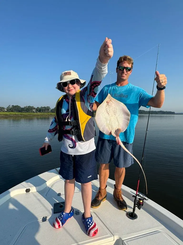 Fishing with two people at an unknown location