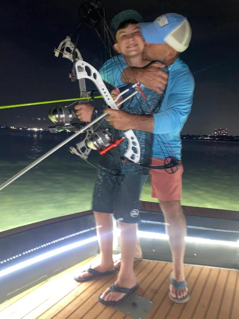 Two people fishing at an unknown location