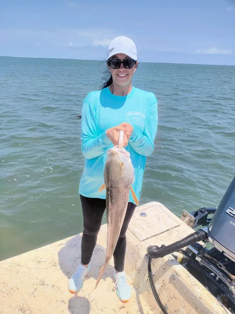 Angler with a large 23-inch fish during fishing