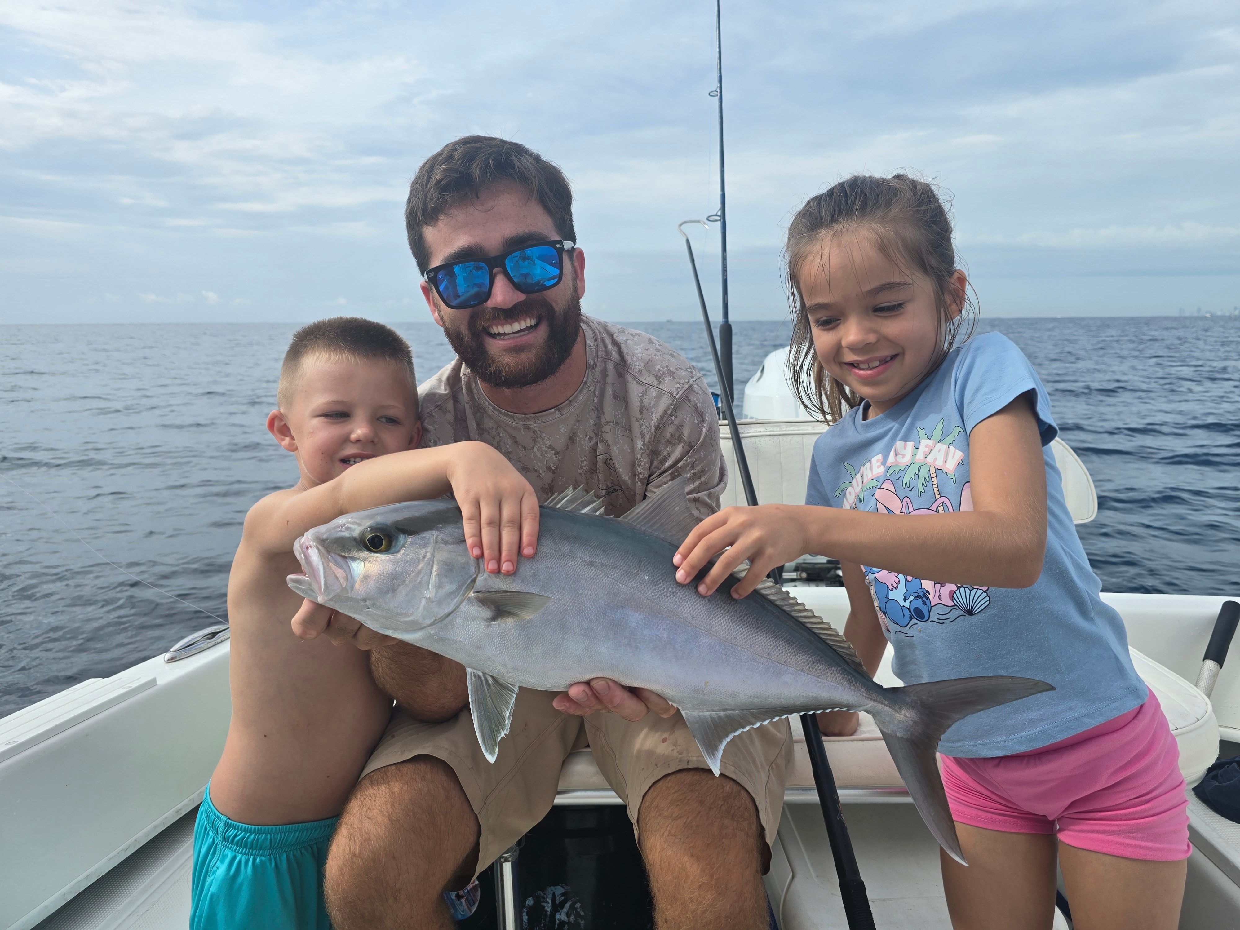 Greater amberjack caught during offshore fishing trip on boat