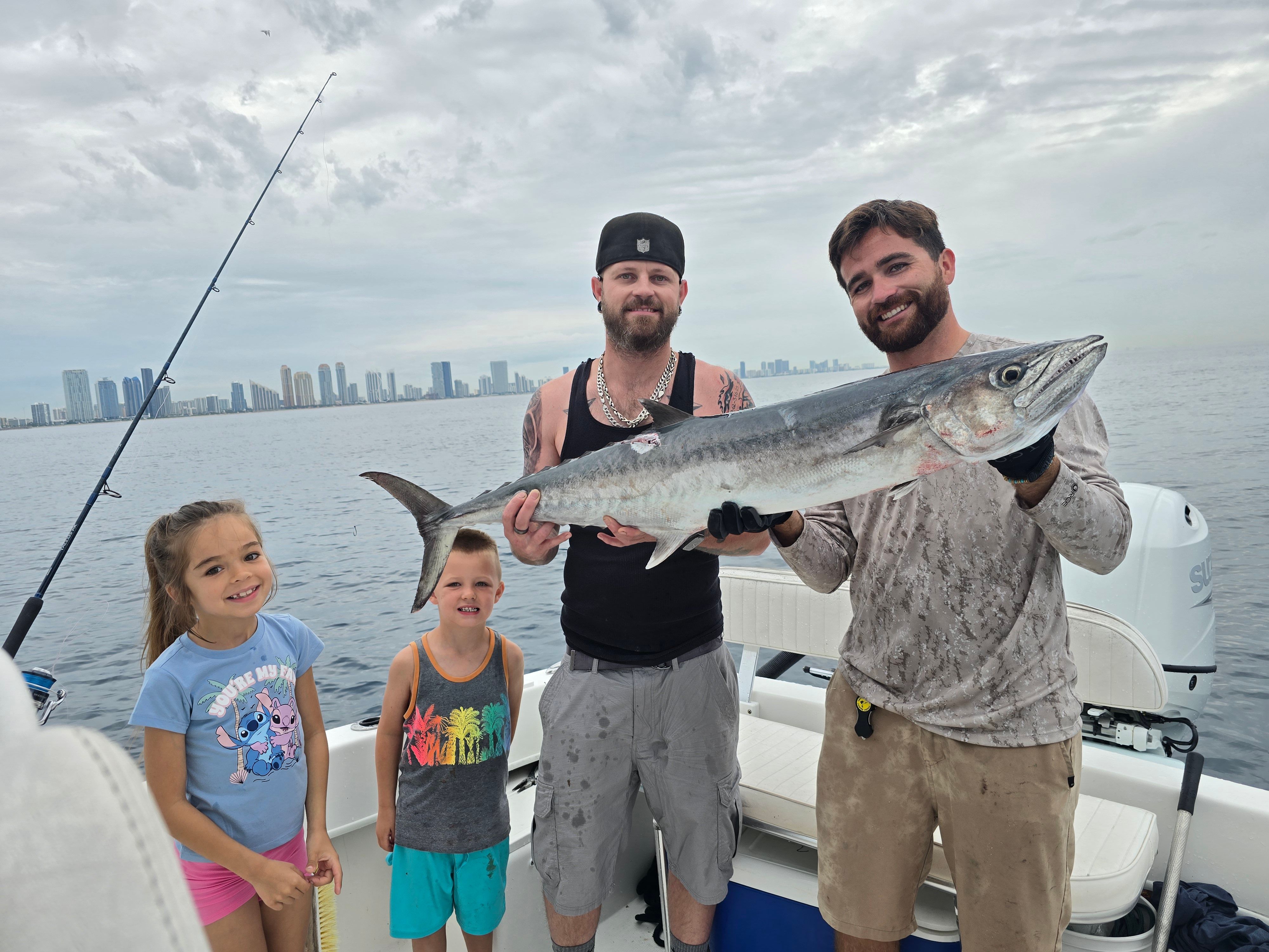 King mackerel caught during offshore fishing charter with family on boat