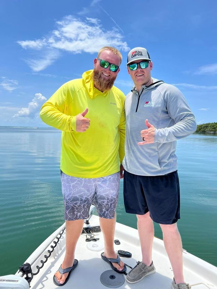 Two anglers fishing in a scenic location
