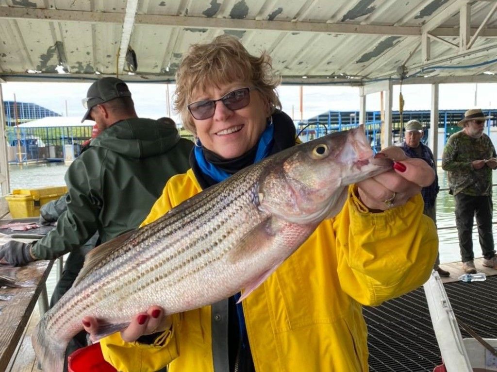All smiles when I caught my prized Striped Bass!