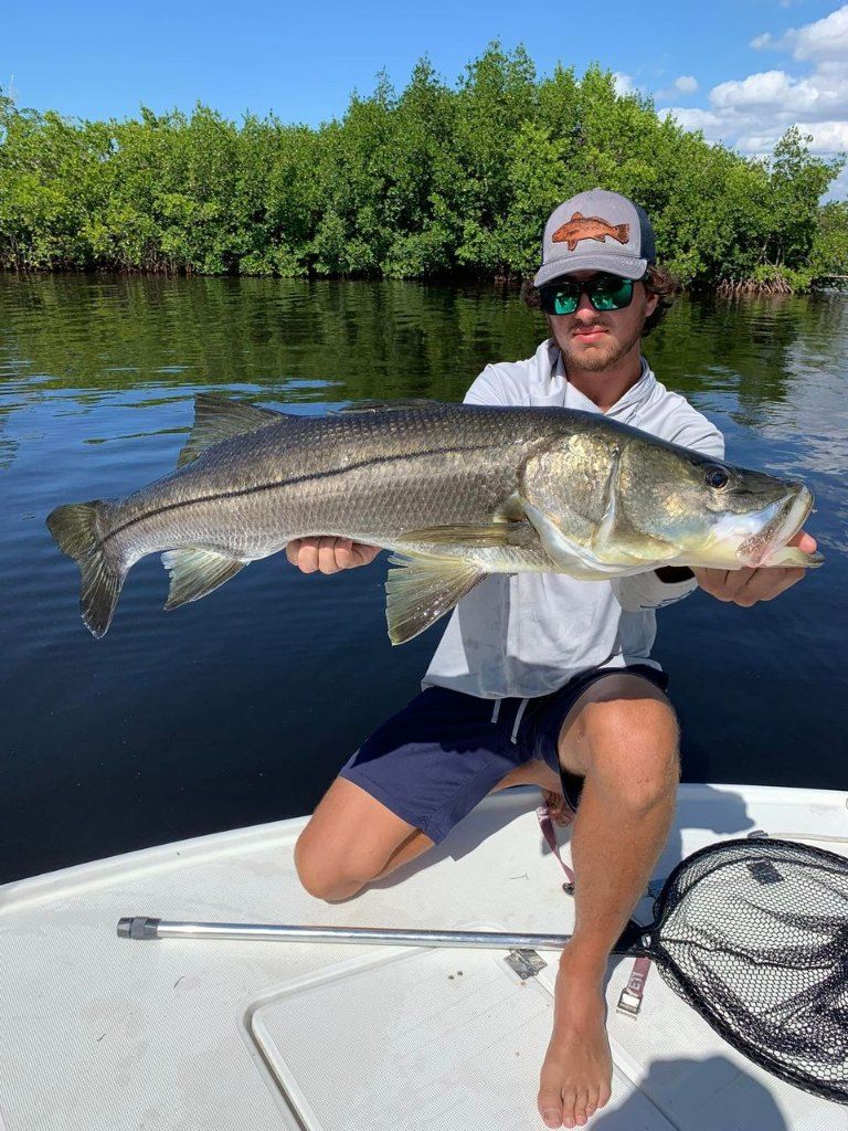 A snook fish caught by a fisherman
