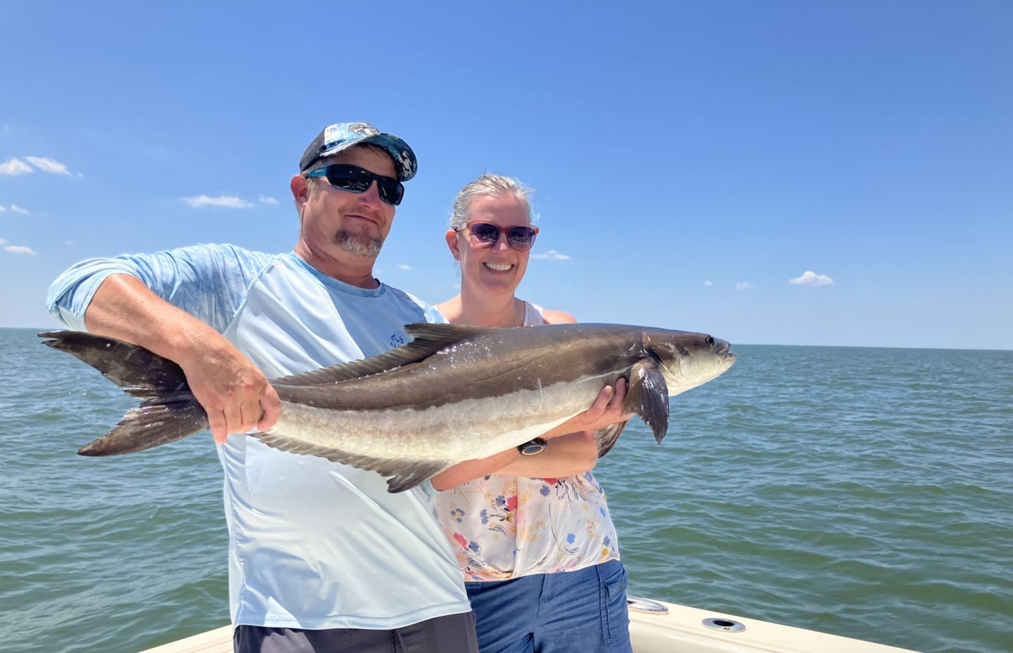 Anglers with a big fish caught while fishing