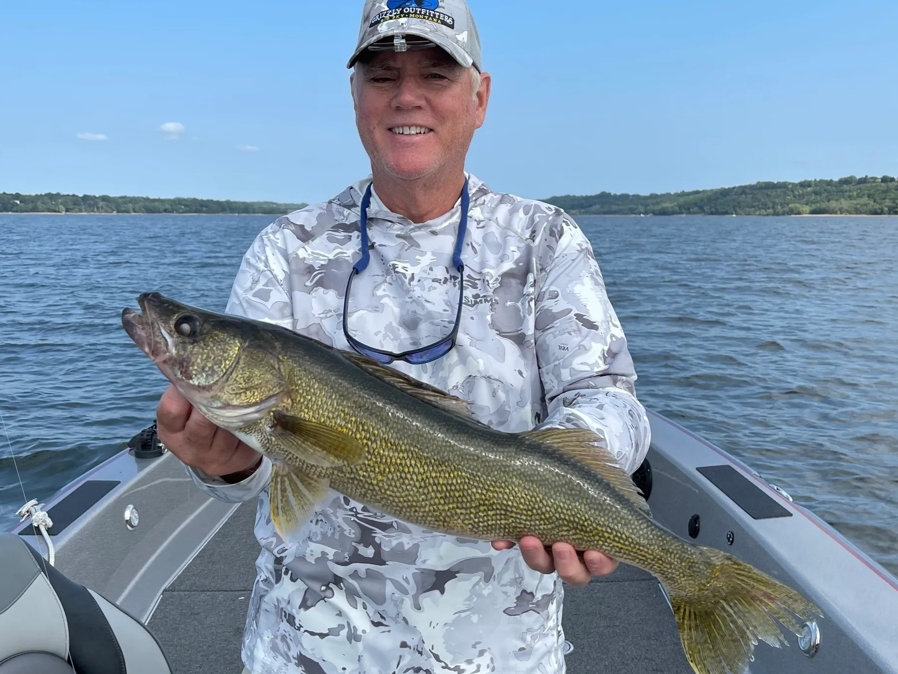 Angler holding a walleye caught on a guided St. Croix River trip