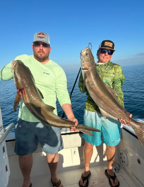 Two people fishing with big 27-inch fish in Key West