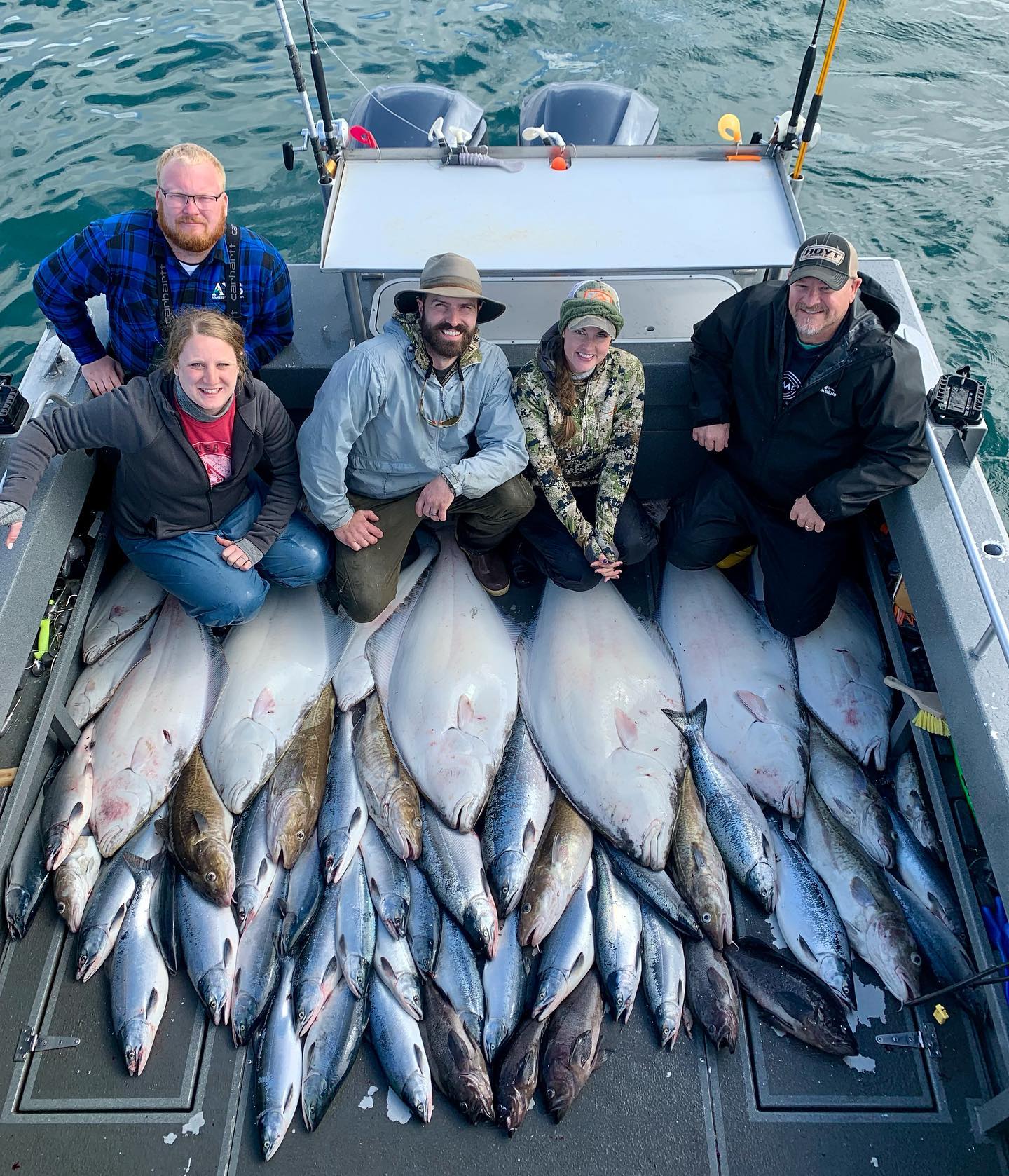 Homer Alaska halibut salmon fishing charter boat in Cook Inlet with anglers and gear