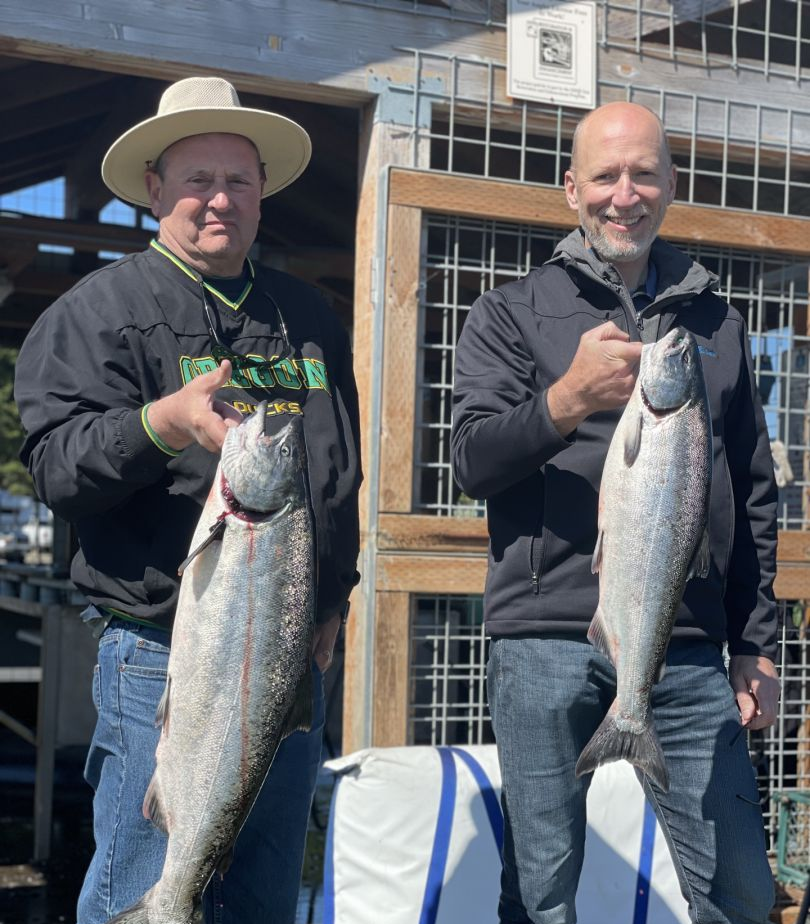 Two Coho Salmon, each 23 inches long, caught while fishing in Eugene