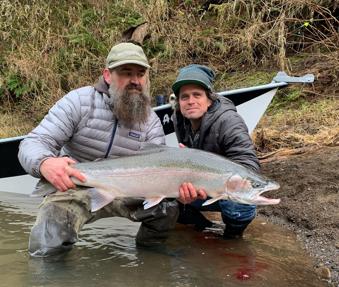 Pink salmon being reeled in during fishing trip in OR