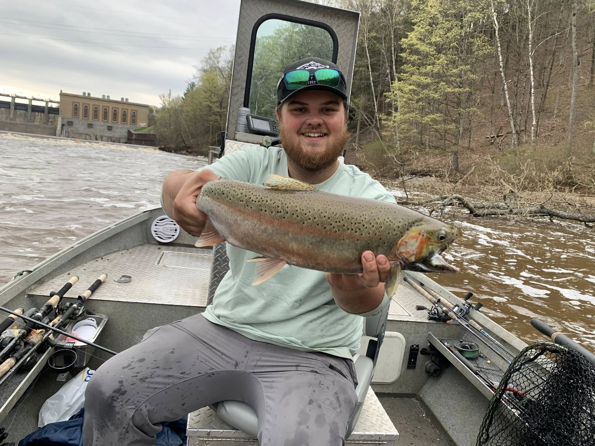Rainbow trout catch displayed on fishing boat in Brethren MI