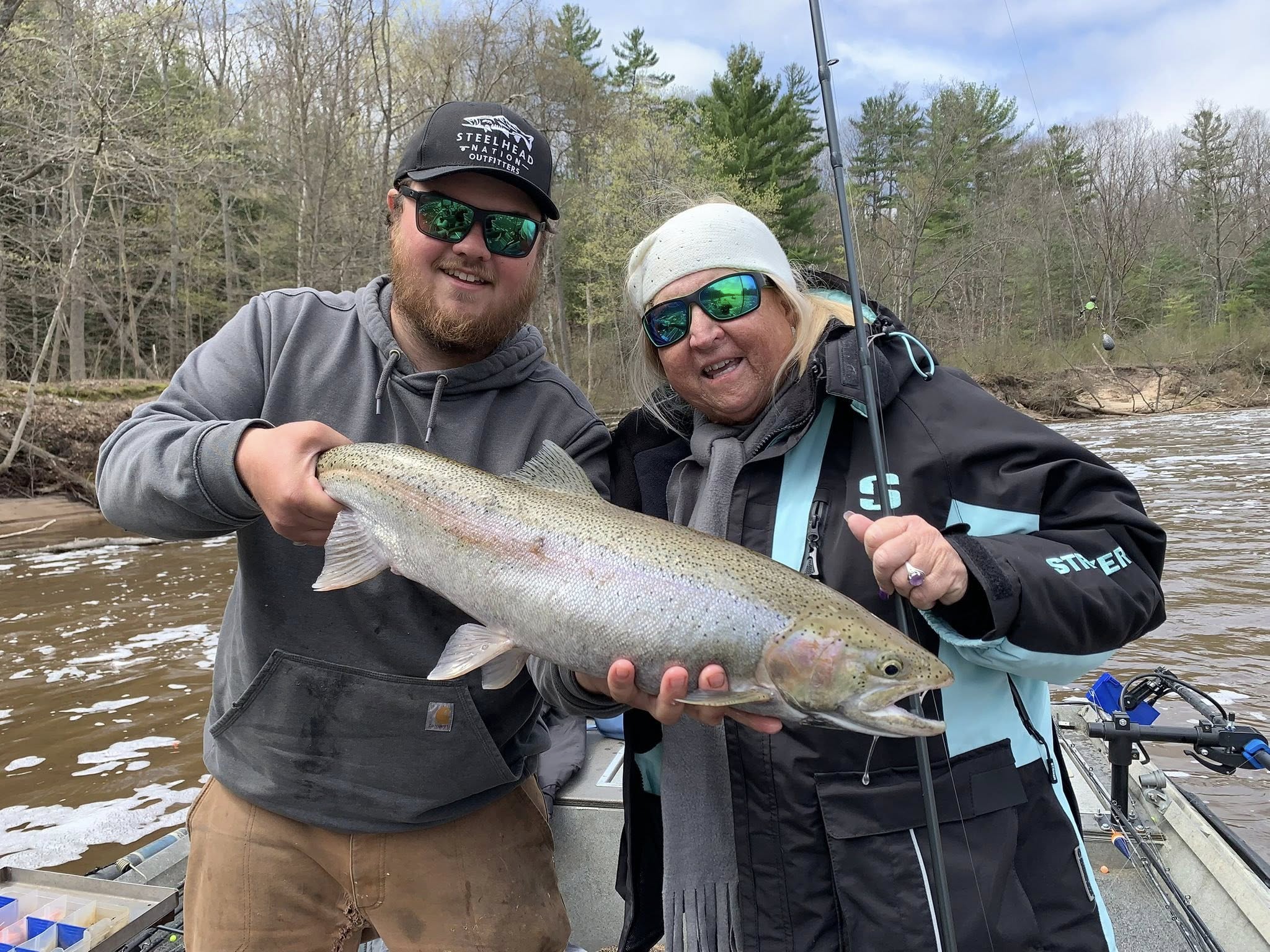 Rainbow trout catch displayed on fishing boat in Brethren MI