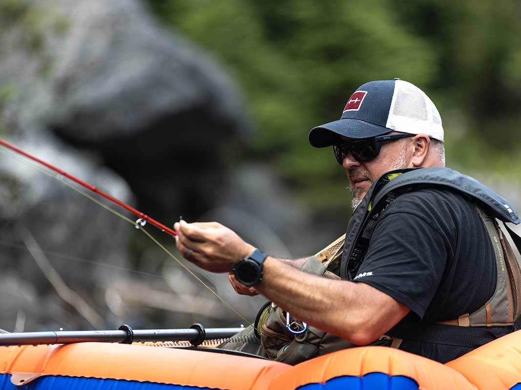 Fly fishing guide with angler wading Puget Sound targeting coastal cutthroat trout in Washington