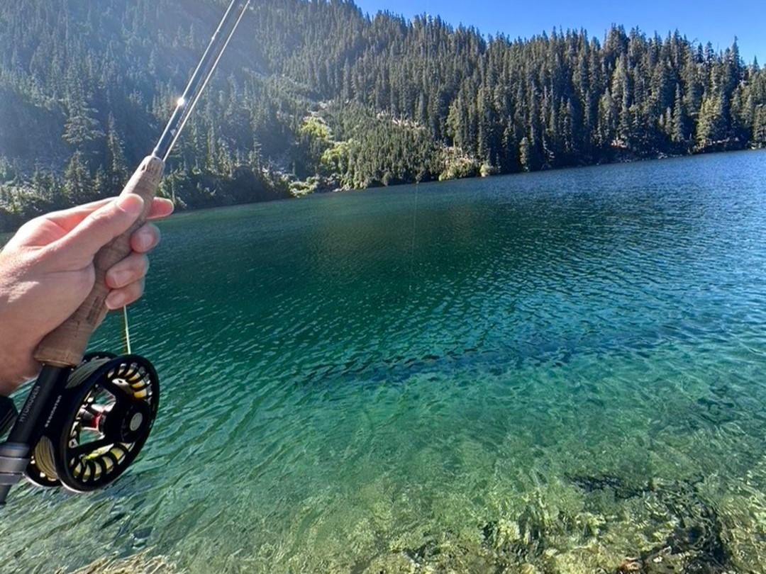 Olympic Peninsula steelhead fly fishing guide with anglers wading in river
