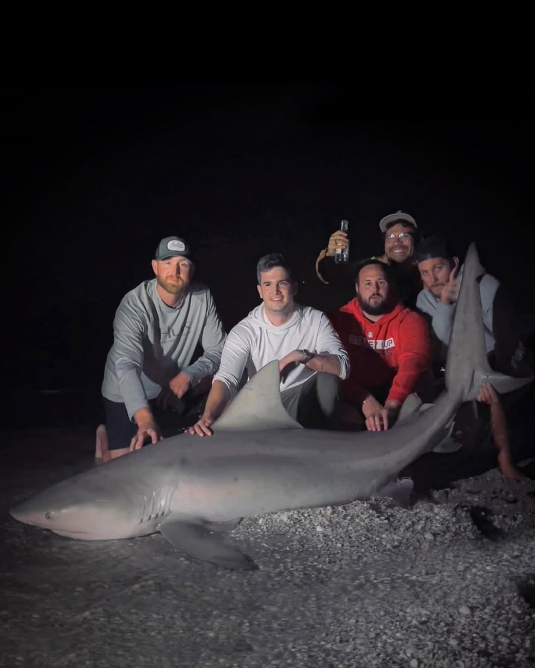 A group of 5 anglers fishing for a bull shark in FL