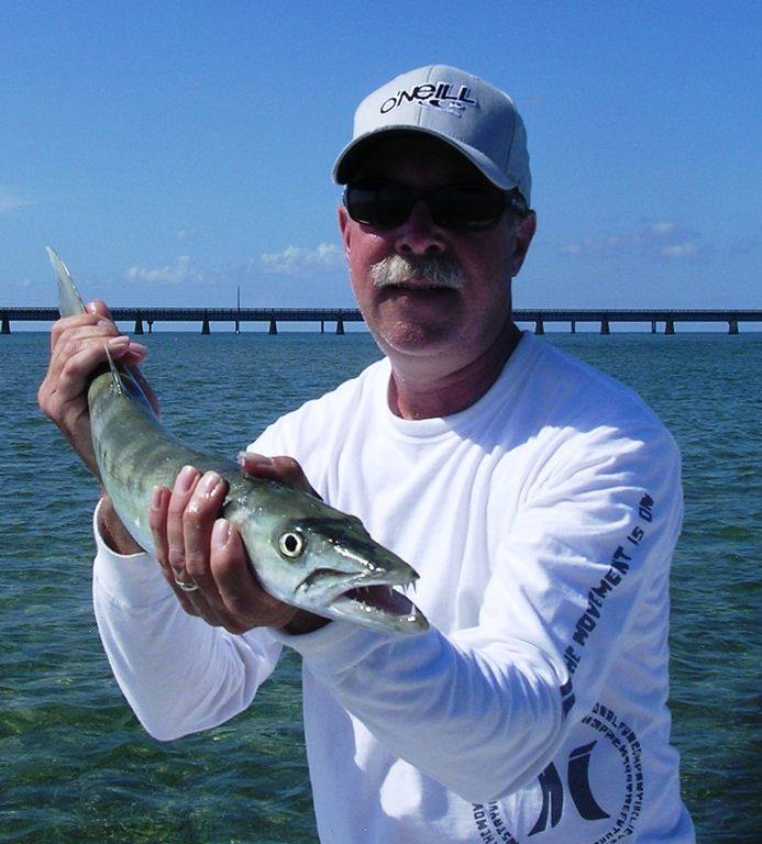 A person fishing in FL with a 9-inch fish