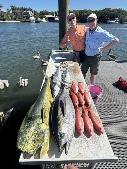 Fresh caught blackfin tuna and mahi mahi displayed on dock in Jensen Beach FL