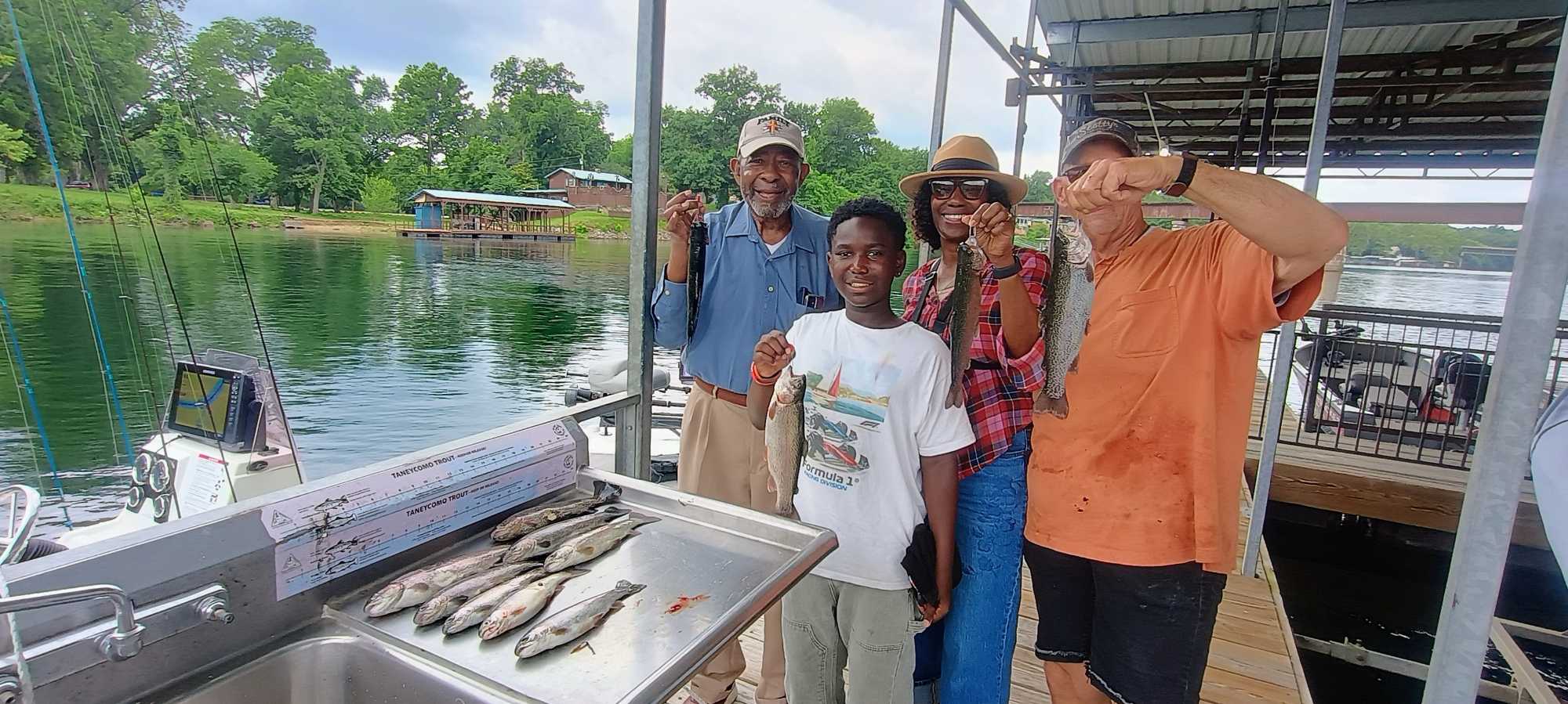Successful fishing trip in Branson MO with fresh caught fish displayed on boat deck