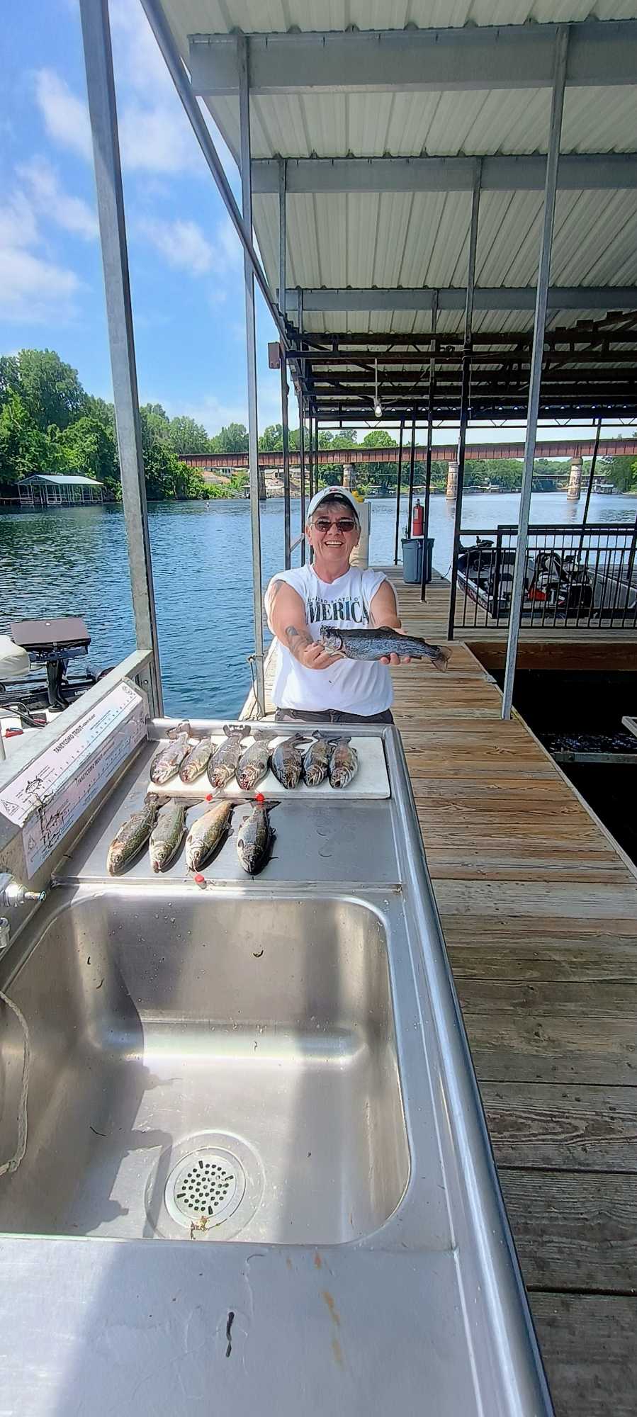Fresh caught fish displayed on cleaning station at marina dock in Branson MO