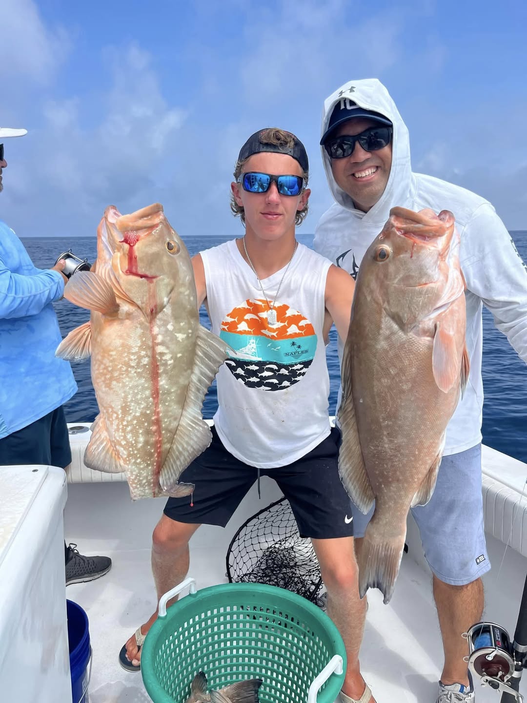 Two anglers fishing at Belleair Bluffs, catching 27-inch fish