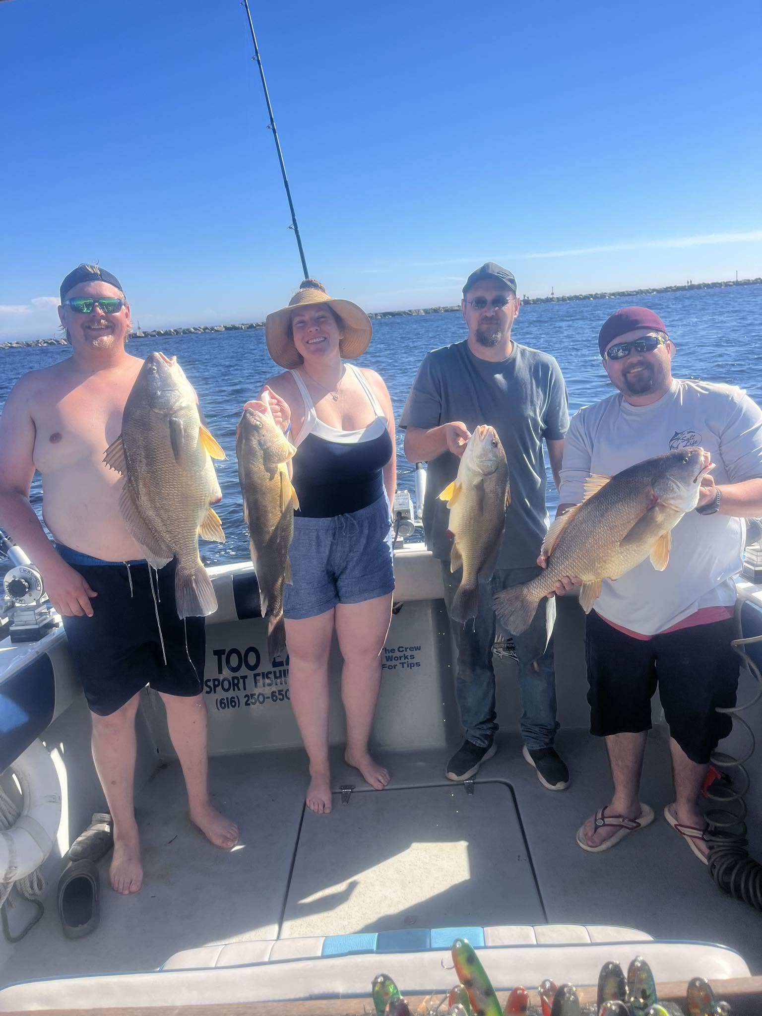 Successful fishing trip in Muskegon MI with freshwater drum catch displayed on charter boat