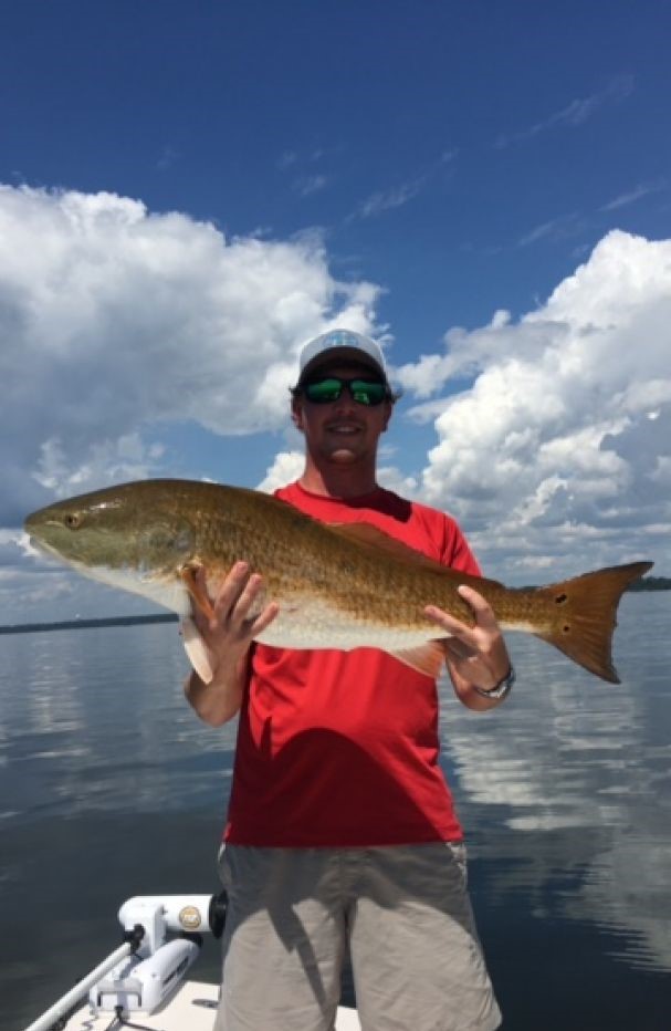 A lone fisherman reeling in his catch in Florida