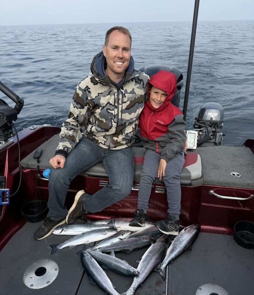 Two people fishing in MI