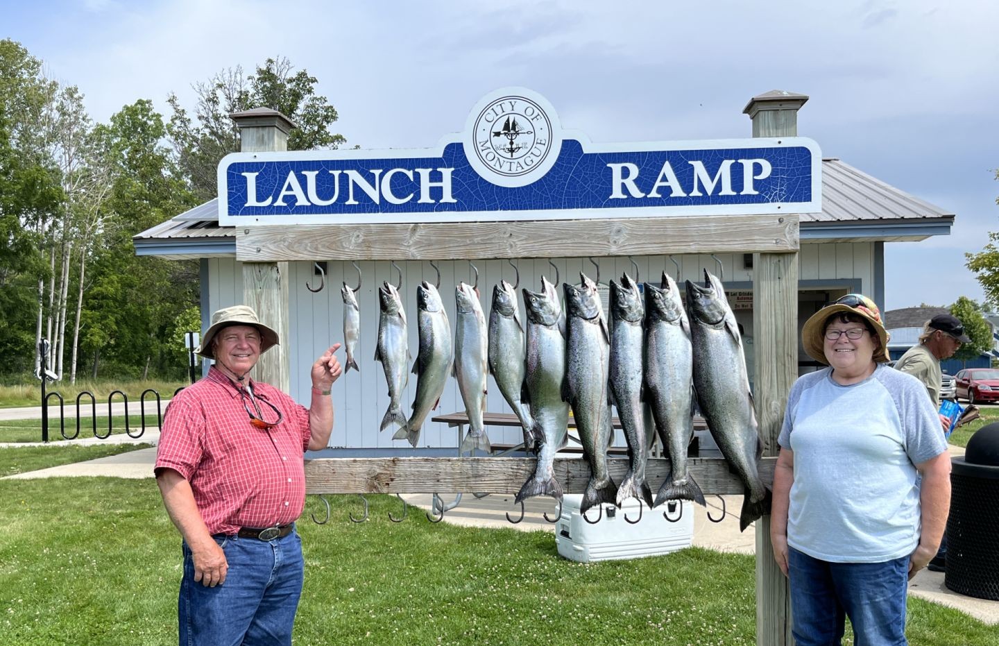 Fishing enthusiasts enjoying a successful day on the water in MI.