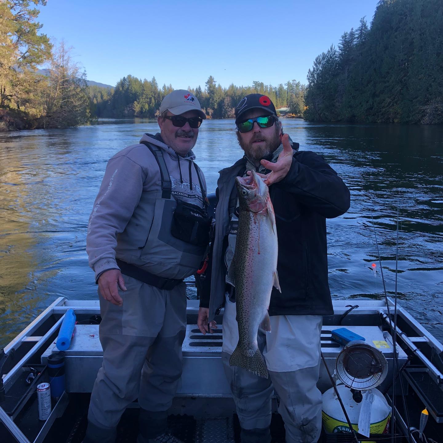 Angler holding a large rainbow trout in BC