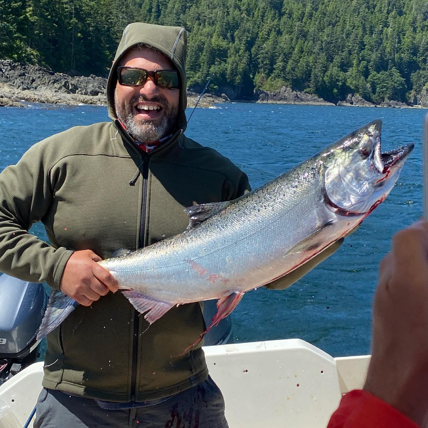 Fisherman with a 21-inch fish in BC