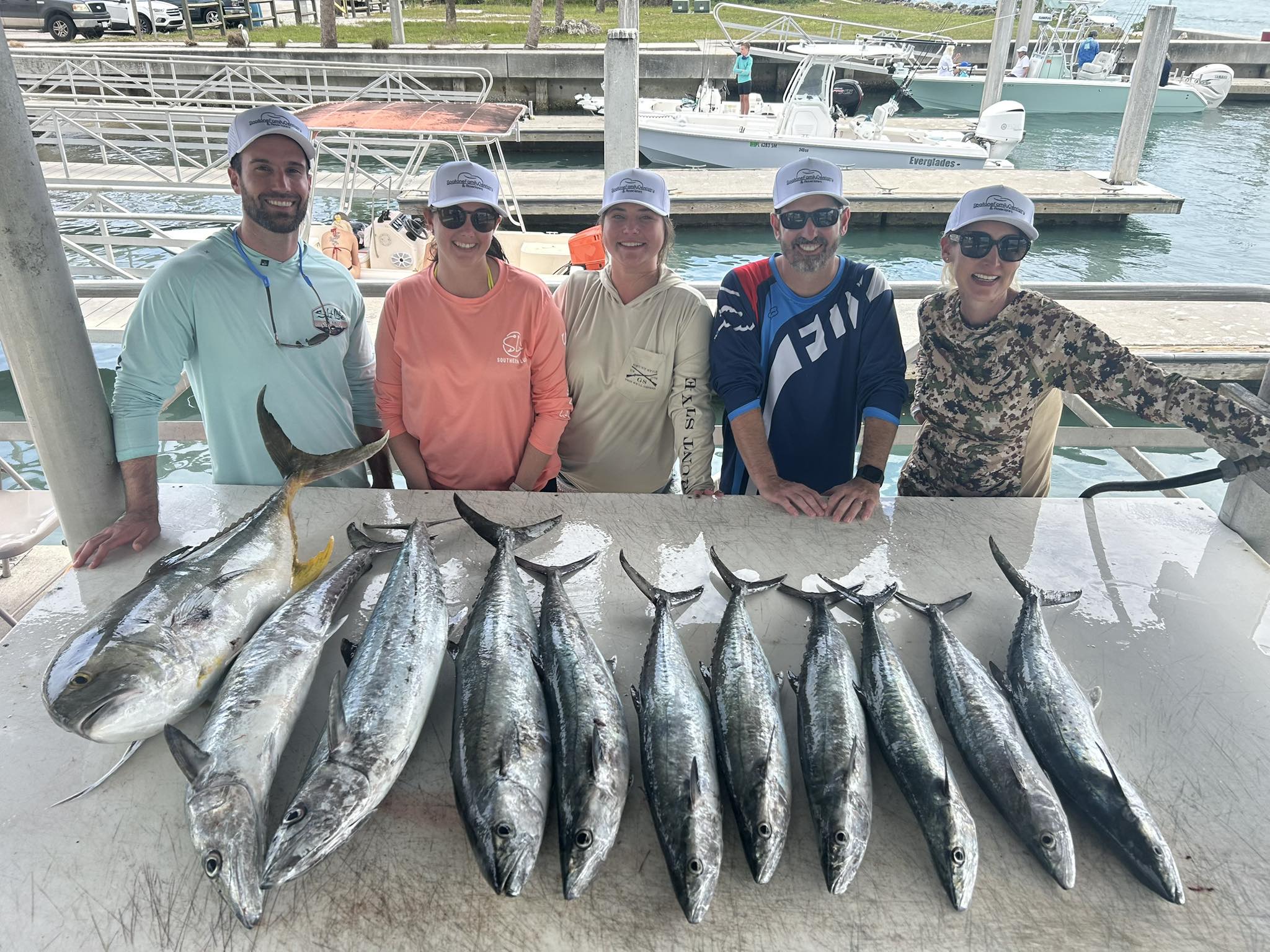 King mackerel fishing catch displayed at Vero Beach FL marina with multiple large fish lined up