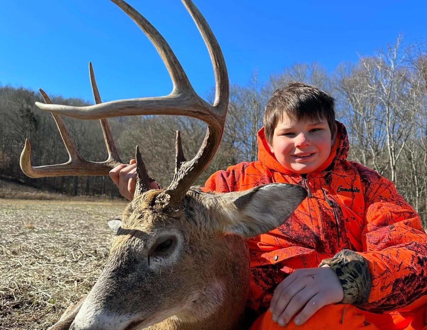 Ohio bow hunter in tree stand targeting whitetail deer in Sunfish Valley private hunting grounds