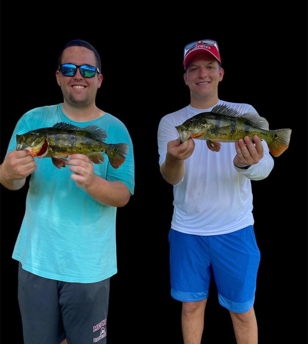 Two anglers reeling in their catch in Florida
